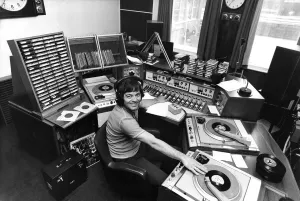 Radio I disc-jockey Tony Blackburn at the studio console equipped with all the tricks of