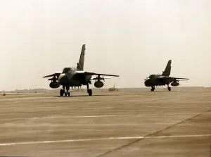 Two RAF Panavia Tornado F3 fighter planes used in the Gulf War taxi along runway