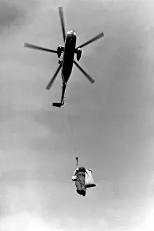 00375 Prints: A RAF Sea King helicopter lowers Father Christmas to the ground