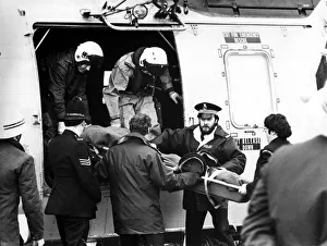 A RAF search and rescue Sea King helicopter from RAF Boulmer airlifts an injured man to