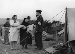 Tents Prints: An RAF Sergeant interpreter discusses domestic business with Portuguese women who have
