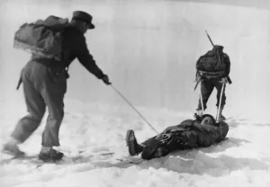 Sledge Prints: Raid on Spitzbergen (Svalbard). Norwegian ski troops pulling a comrade on a sledge