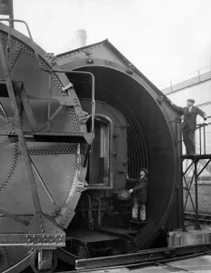 Carriage Prints: Railway carriages. The plant at Swindon showing carriage in cylinder ready to be sealed