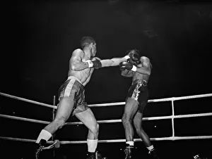 Randolph Turpin lands a punch during his title fight against Sugar Ray Robinson fight