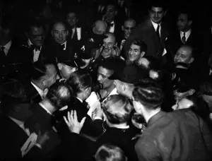 Reporter Prints: Randolph Turpin makes his way to the dressing room through the crowds after his fight