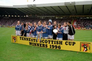 Rangers football team line up with their trophy after beating Hearts in the Tennents