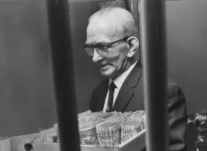 00247 Prints: Rangers Pools manager Alec Paterson puts away a tray of fivers