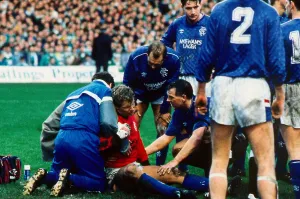 Rangers versus Celtic : Chris Woods receives treatment for injury January 1988