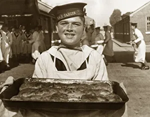 Bakery Prints: A rating at the Royal Navy training base HMS Ganges collects the food for lunch for his