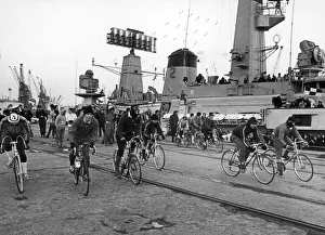 00495 Prints: Ratings from HMS Jupiter seen here taking part in a cycle race started from the bridge of
