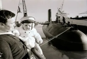 Nuclear Prints: One of the ratings of the new submarine HMS Conqueror shows off his new ship to his son