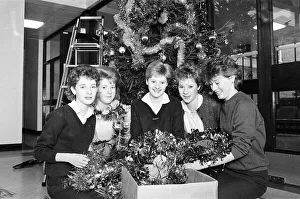 Rawthorpe High School pupils decorating the Christmas Tree in the entrance to St Luke