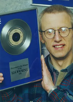 00035 Prints: Ray Laidlaw of Lindisfarne, with the silver disc donated as a trophy for the Lindisfarne