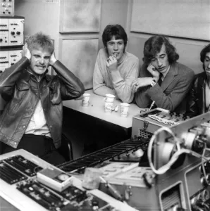 Audio Prints: Ray Moore (left) andBarry and Robin Gibb of the Bee Gees pop group listening to