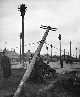 01451 Prints: RCS men in training. Erecting outside telegraphic communications and wiring