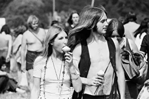 Reading Pop Festival. Festival goers eating ice creams as they make their way to
