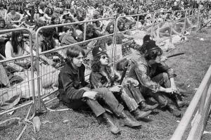 Hippy Prints: Reading Pop Festival. Music fans wearing police helmets