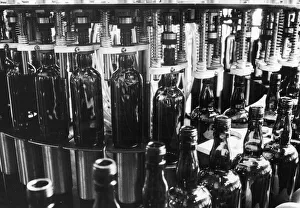 Whiskey Prints: The Real Scotch Whisky - An automatic filling machine at the bottling plant