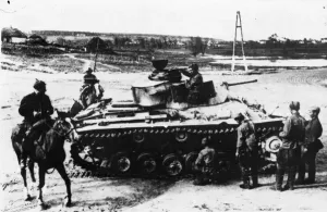 Russia Prints: Red Army guardsmen inspecting an abandoned German tank. It is in a village where
