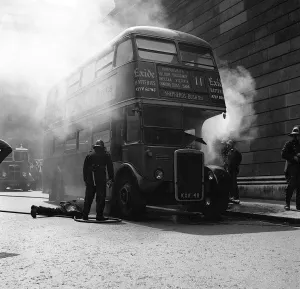 Red Double Decker Bus on Fire - May 1959 firemen attempt to tackle the fire