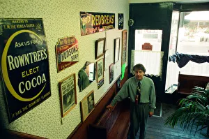 Redcar barber Mike Forbes with some of his collection of memorabilia in his shop