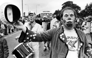 Instruments Prints: Reg Graves leads the LMS Pandemonium band in the parade at the Garston Carnival