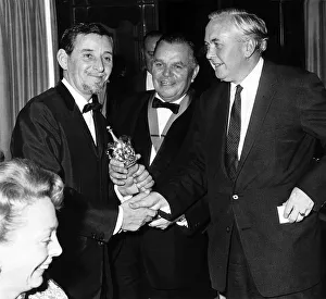 Reg Smythe Cartoonist 1965 LEFT receives an award from Prime Minister Harold Wilson PM
