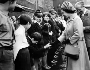 A regal curtsey for Queen Elizabeth II from 11-year-old Sheila Murray at Stockport