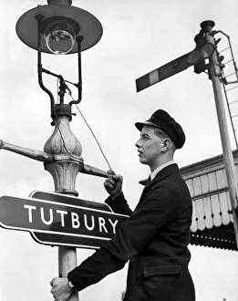 00413 Collection: Relief porter Peter Kelly at work at Tutbury Station, October 1957
