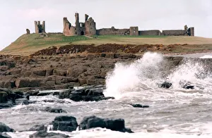 00083 Prints: The remote and impressive ruins of Northumberlands Dunstanburgh Castle in July 1996