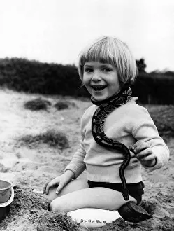 00000 Prints: Reptiles : Children and Snakes. Now that the summer visitors have left the Devon seaside