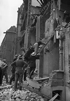 01431 Prints: A rescue by the National Fire Service when a flying bomb crashed on flats at Nevern