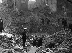 Aftermath Prints: Rescue party searching amongst debris for trapped victims of a bomb dropped on a