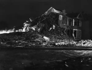Rescue workers dig through the rubble after a V2 missile exploded at the junction of
