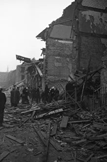 Rescue workers search the collapsed buildings of the Central London Ophthalmic Hospital