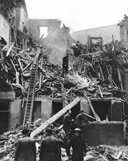 Searching Prints: Rescue workers search the ramains of a tenament building in Kent Street Glasgow hit