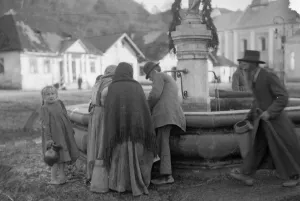 Head Scarf Prints: Residents collect water from the spring in the market place in Halicz Galicia