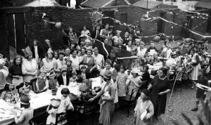 Bunting Prints: The residents of Mill Street, off Scotswood Road in Newcastle taking part in a street