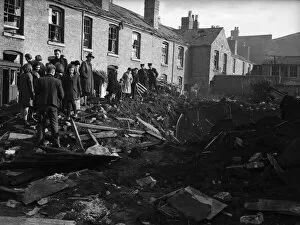 Rubble Collection: Residents of Vincent Street Balsall Heath, Birmingham, examine a bomb crater following an