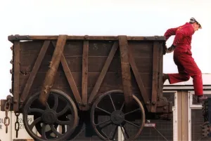 Wagon Prints: Restoration engineer Grodon Stark is helping to move an anciet wagon at the Stephenson