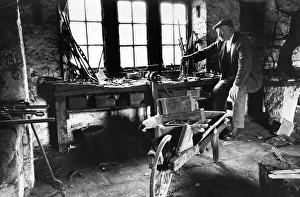 00023 Prints: Retired blacksmith Tom Armstrong looks over the empty smithy at Matfen wondering if