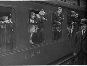 Derbyshire Prints: Returning evacuee children wave goodbye to Derby as their train moves out