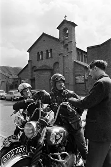 The Rev. Les Milner talking with members Raymond Fox (right
