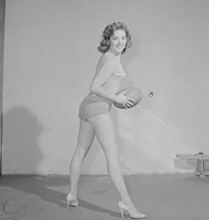 Keep Fit Prints: Reveille Fashion Feature The Vernon girls pose with rugby balls in the reveille