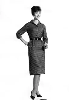 00048 Prints: Reveille Fashion. Mannequin wearing a belted mid sleeve dress. January 1961 P006881