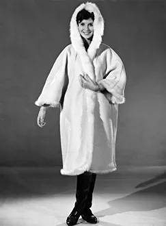 Reveille Fashions 1963: Ann Cave wearing a fur trimmed winters coat