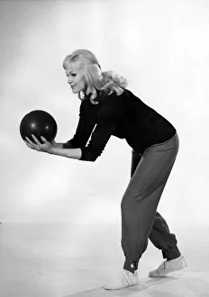 Reveille Fashions 1964: Jo Waring wearing a bowling suit of slacks and jumper