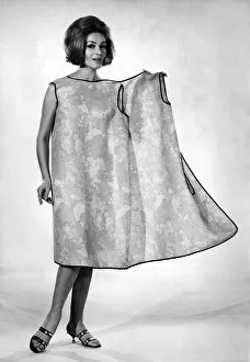 00056 Prints: Reveille Fashions: Helen Norman modeling the latest in house coats for the house wife