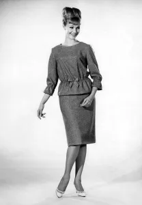 00048 Prints: Reveille Fashions: Jo Waring wearing matching twin set. November 1964 P006839