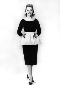 00053 Prints: Reveille Fashions. Mannequin modelling dress and apron. March 1960 P006992